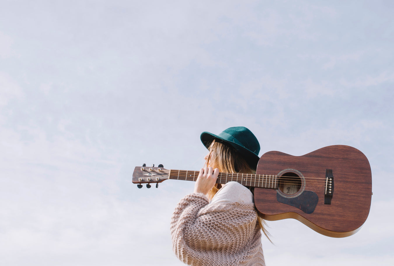 Musican recording acoustic guitar